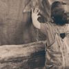 A boy leaning on the Wall